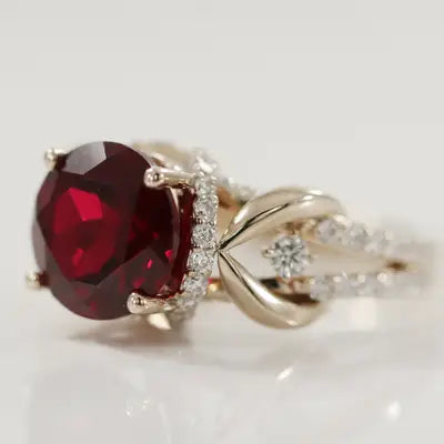 two-tone gold round blood red ruby with under-halo and split band 