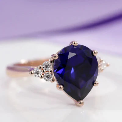 designer blue sapphire diamond accented rose gold engagement ring