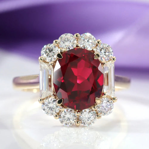 designer 3 carat blood red oval with diamond halo in yellow gold at Quorri