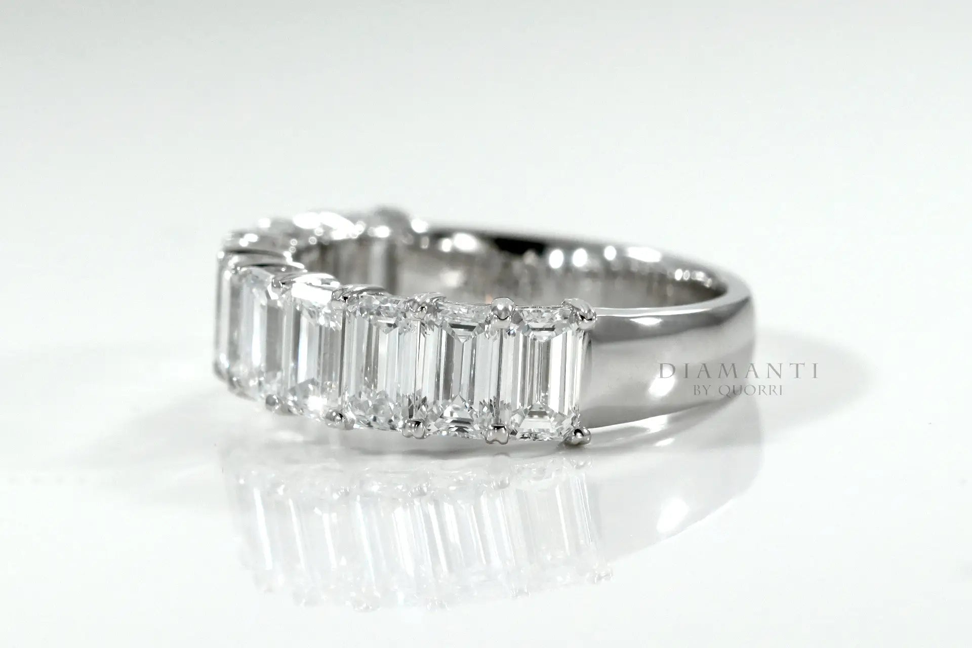 designer 18k white gold emerald cut diamond wedding and anniversary ring at Quorri