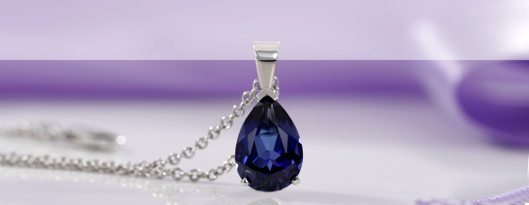 lab grown blue sapphire pear cut pendant in white gold with chain Quorri