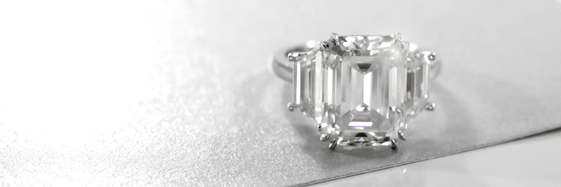 three stone emerald lab diamond engagement ring