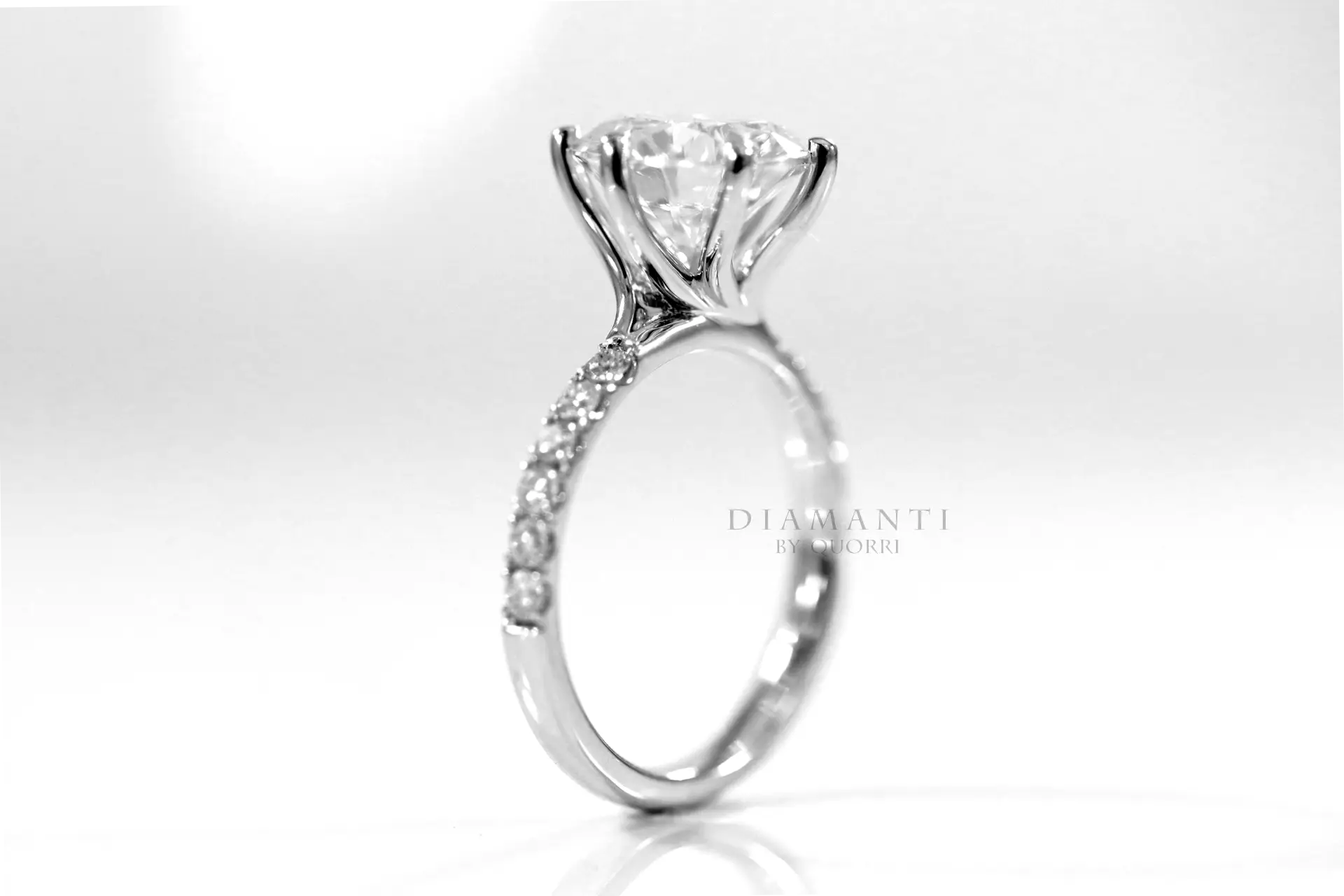 platinum affordable six prong round accented lab diamond engagement ring 