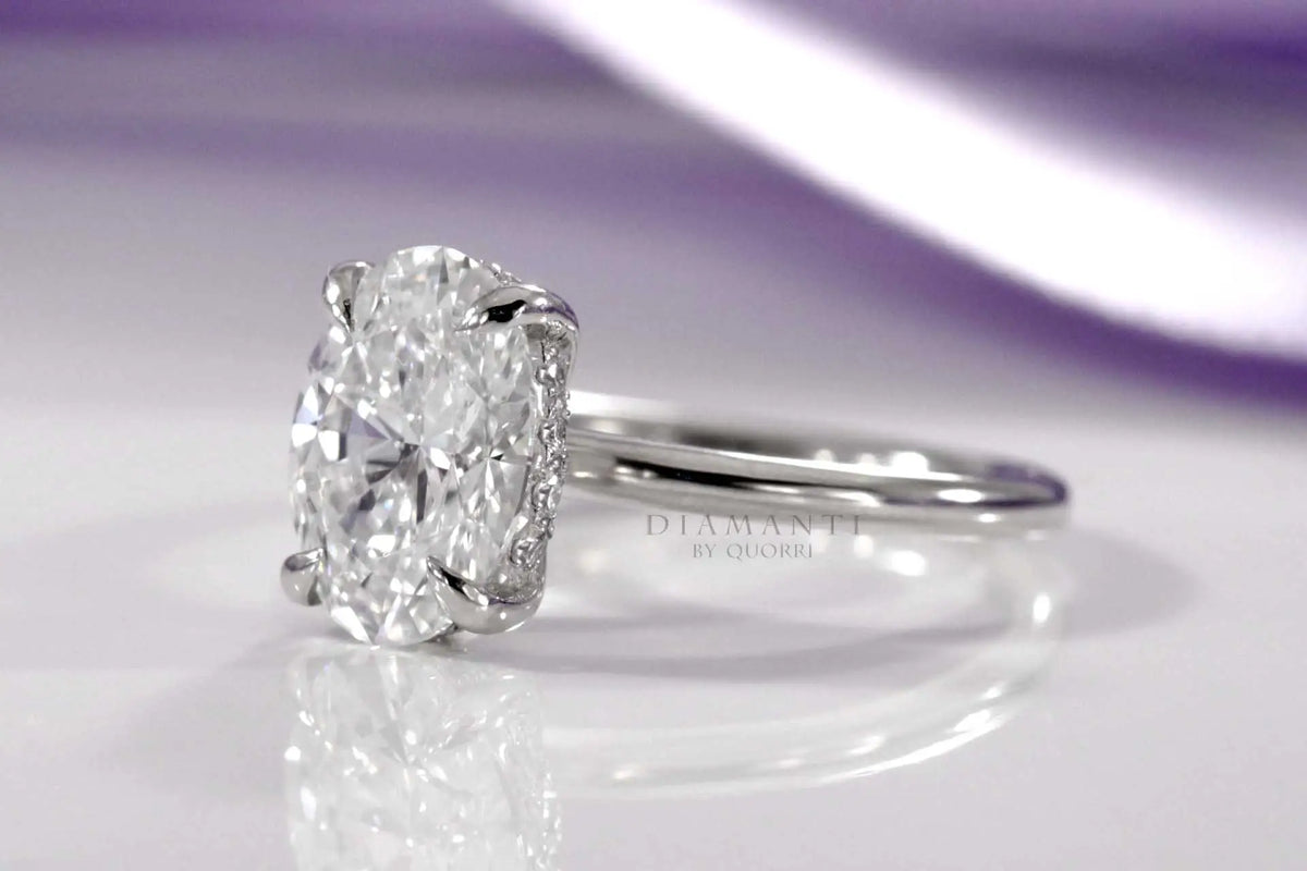 claw prong under-halo oval lab diamond engagement ring