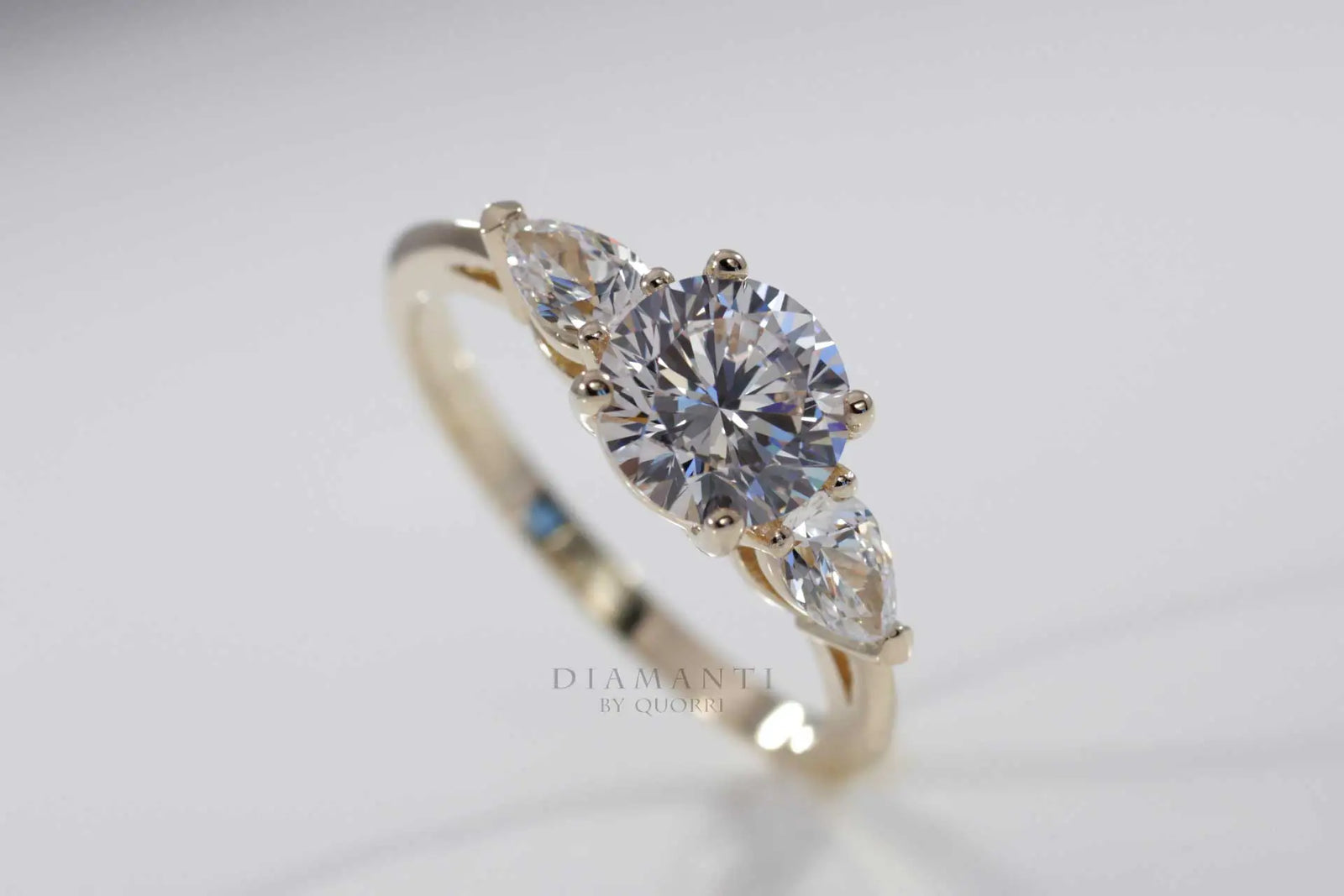 18k yellow gold three stone round and pear accented lab diamond engagement ring Quorri Canada