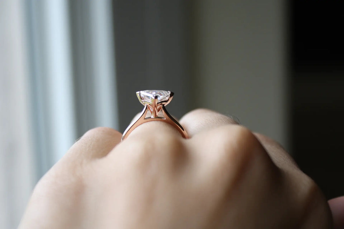 affordable designer v-prong 14k rose gold two carat triangle cut lab made diamond solitaire engagement ring Quorri Canada