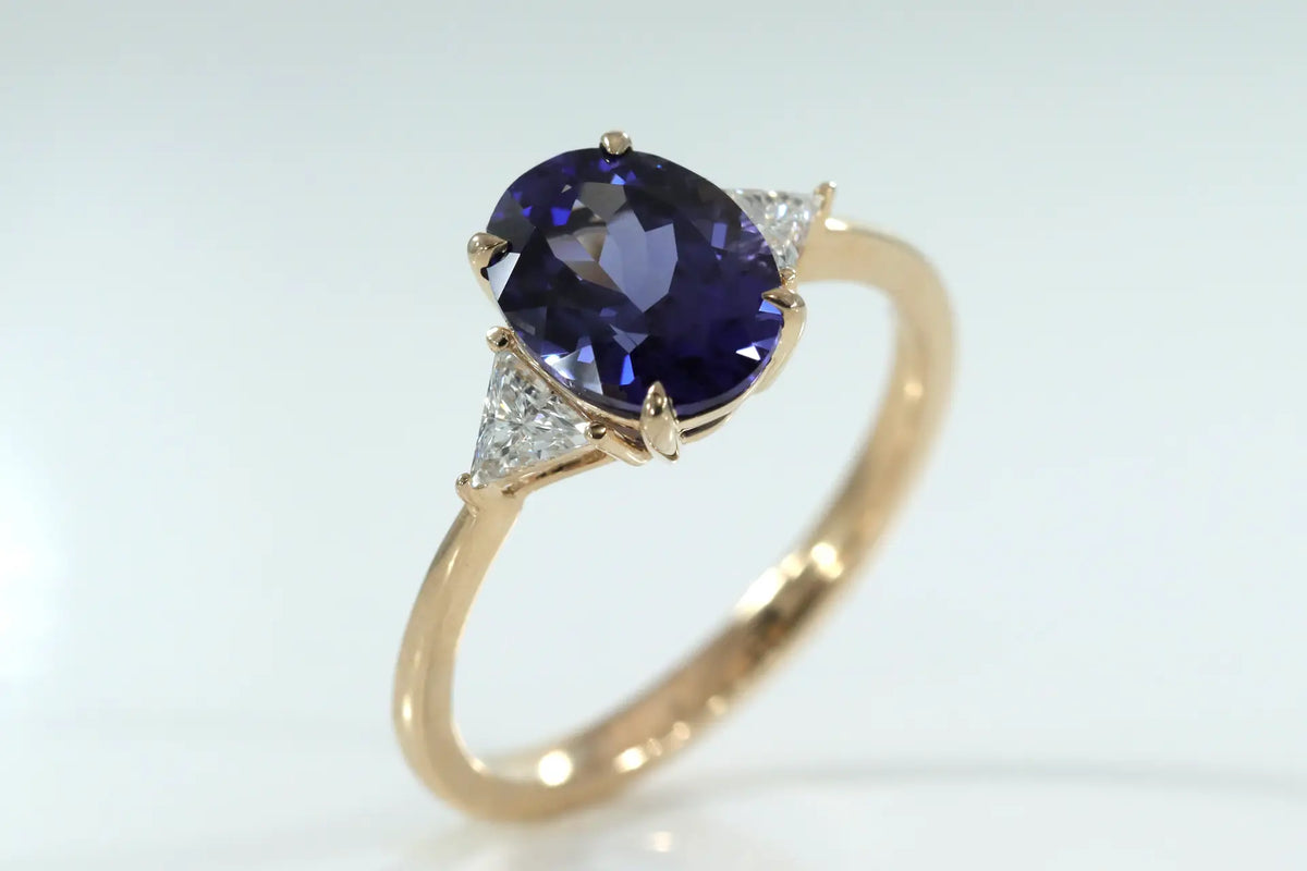 designer three stone 2 carat oval lab grown tanzanite with lab diamond triangle sides engagement ring Quorri
