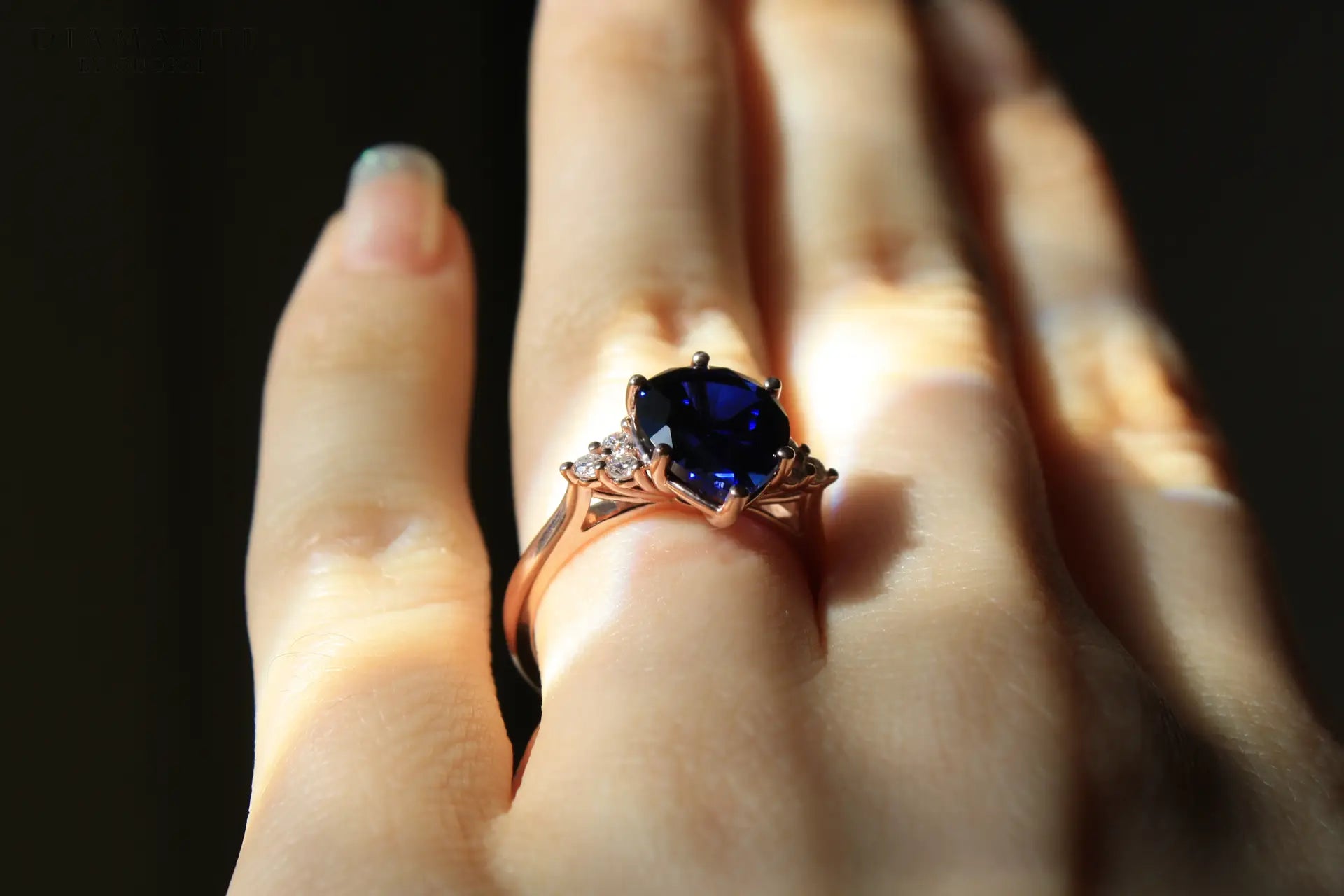 affordable designer 6 prong 2.5 carat pear cut lab grown blue sapphire engagement ring accented with round diamonds Quorri Canada