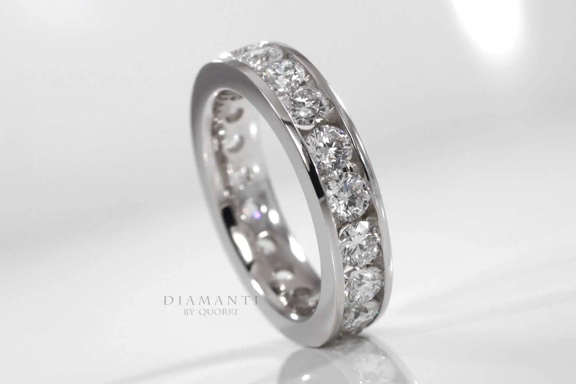 white gold designer round channel set eternity anniversary and wedding band Quorri