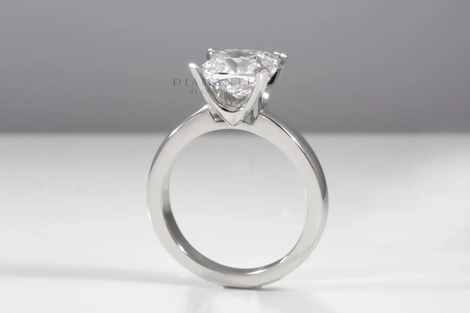 low cost affordable four prong round brilliant lab diamond solitaire engagement ring Quorri