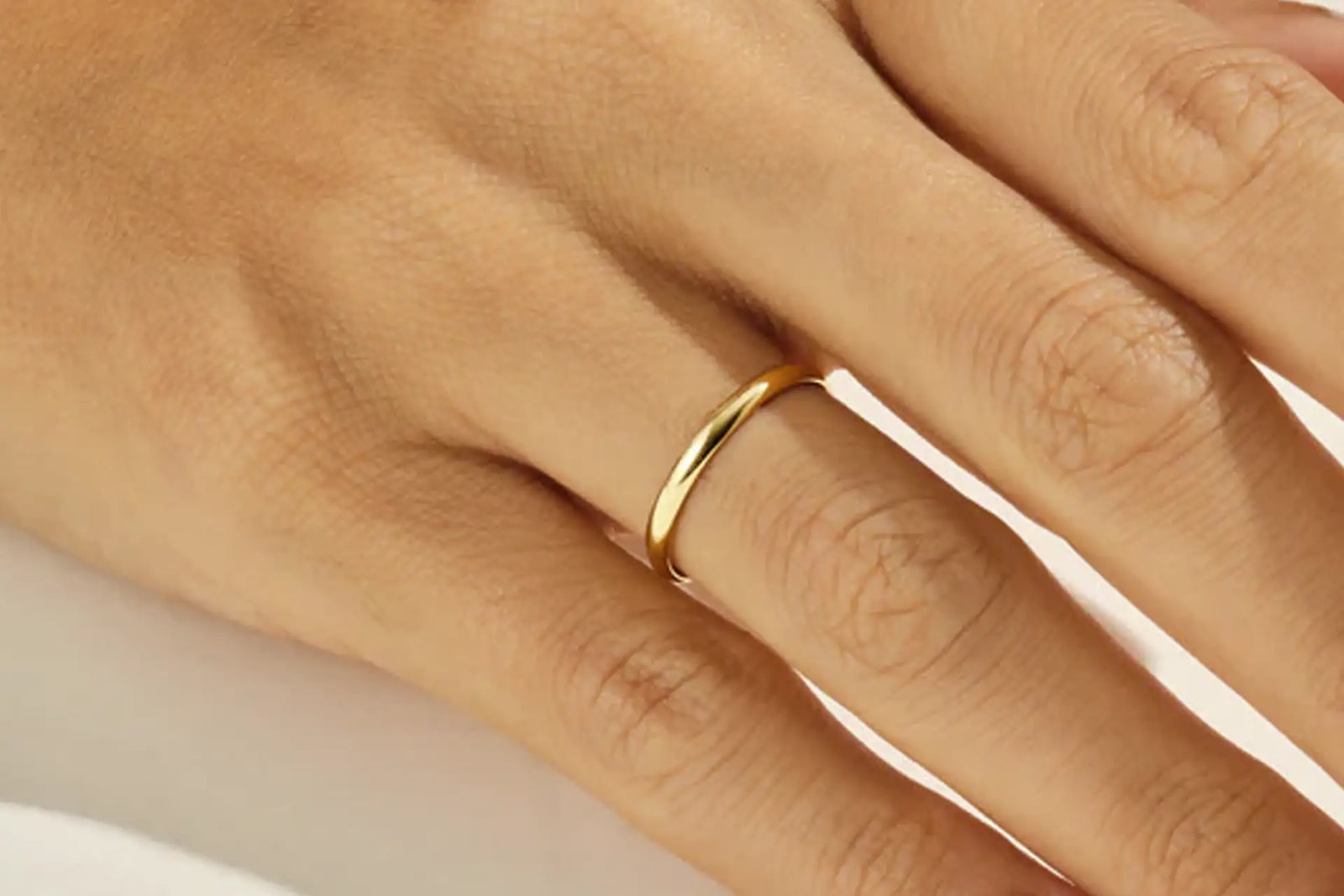 classic solid yellow gold plain 2mm women's wedding band at Quorri