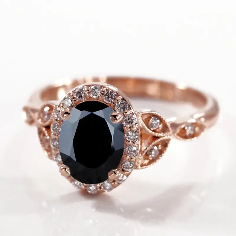 rose gold black diamond oval halo with white diamond accents 