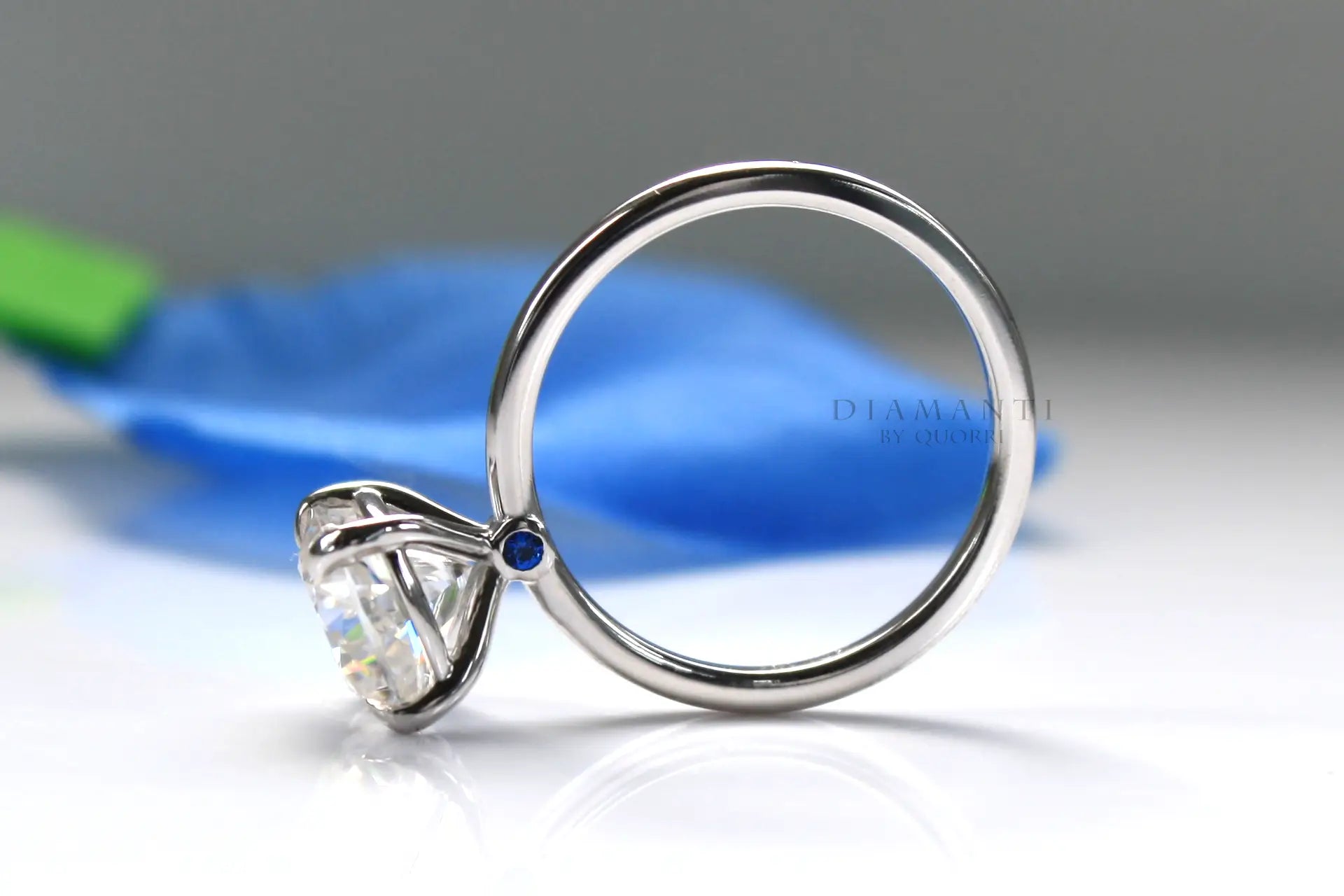 blue sapphire accented claw prong white gold cushion lab diamond engagement ring Quorri 