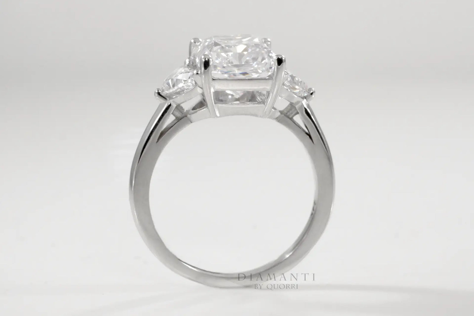 designer three-stone radiant and half moon lab diamond engagement ring Quorri
