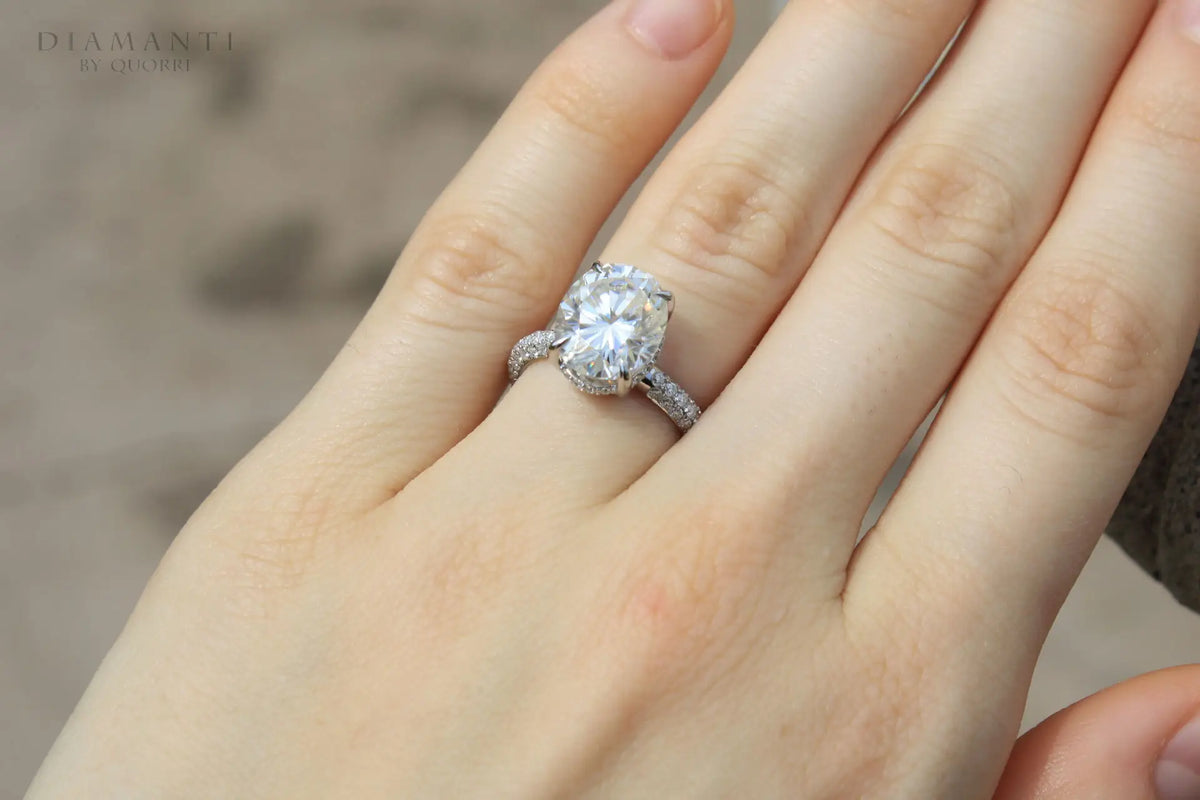 designer white gold 4 carat oval lab diamond claw prong three sided band engagement ring Quorri Canada