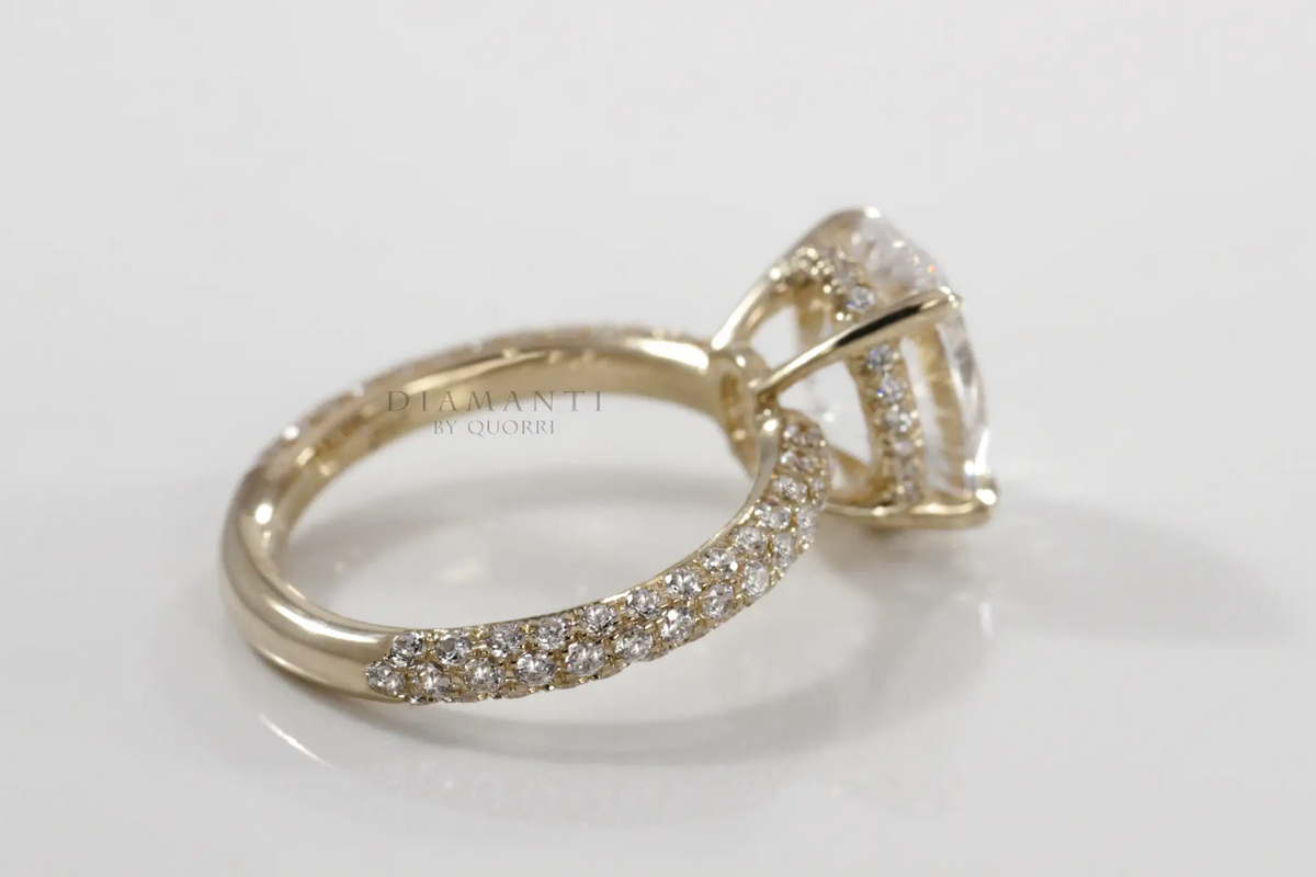 18k yellow gold 2.5 carat oval lab grown diamond claw prong three sided band engagement ring Quorri