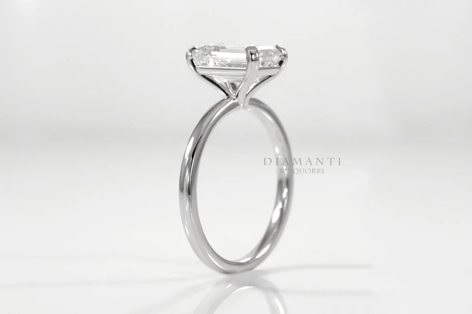 affordable petite promise emerald engagement rings Quorri