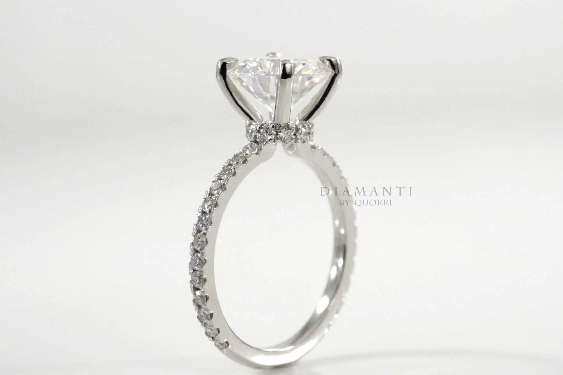 four claw prong 2 carat round lab diamond accented engagement ring
