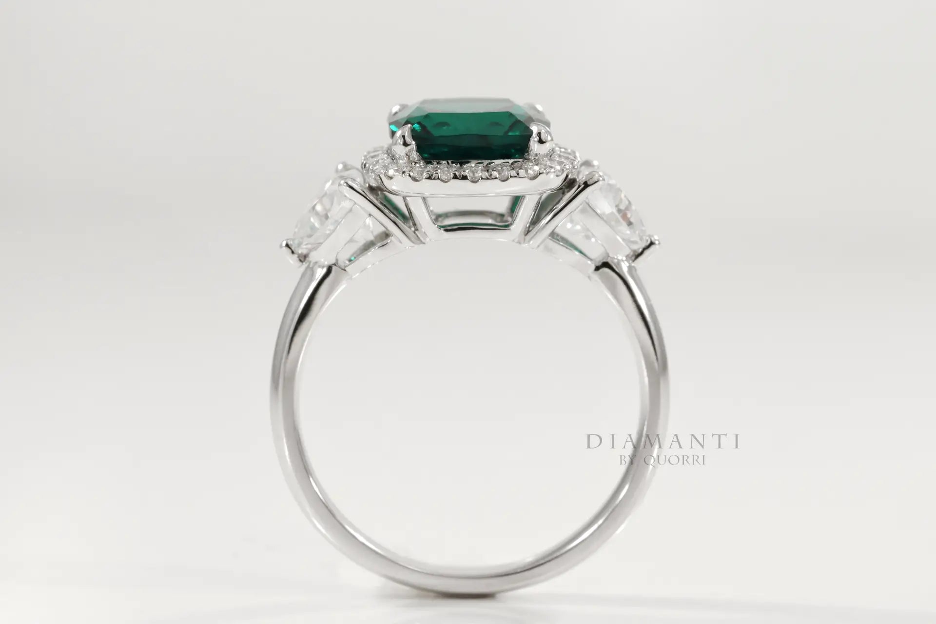 14k white gold cushion cut designer three stone green emerald and trillion halo diamond engagement ring Canada