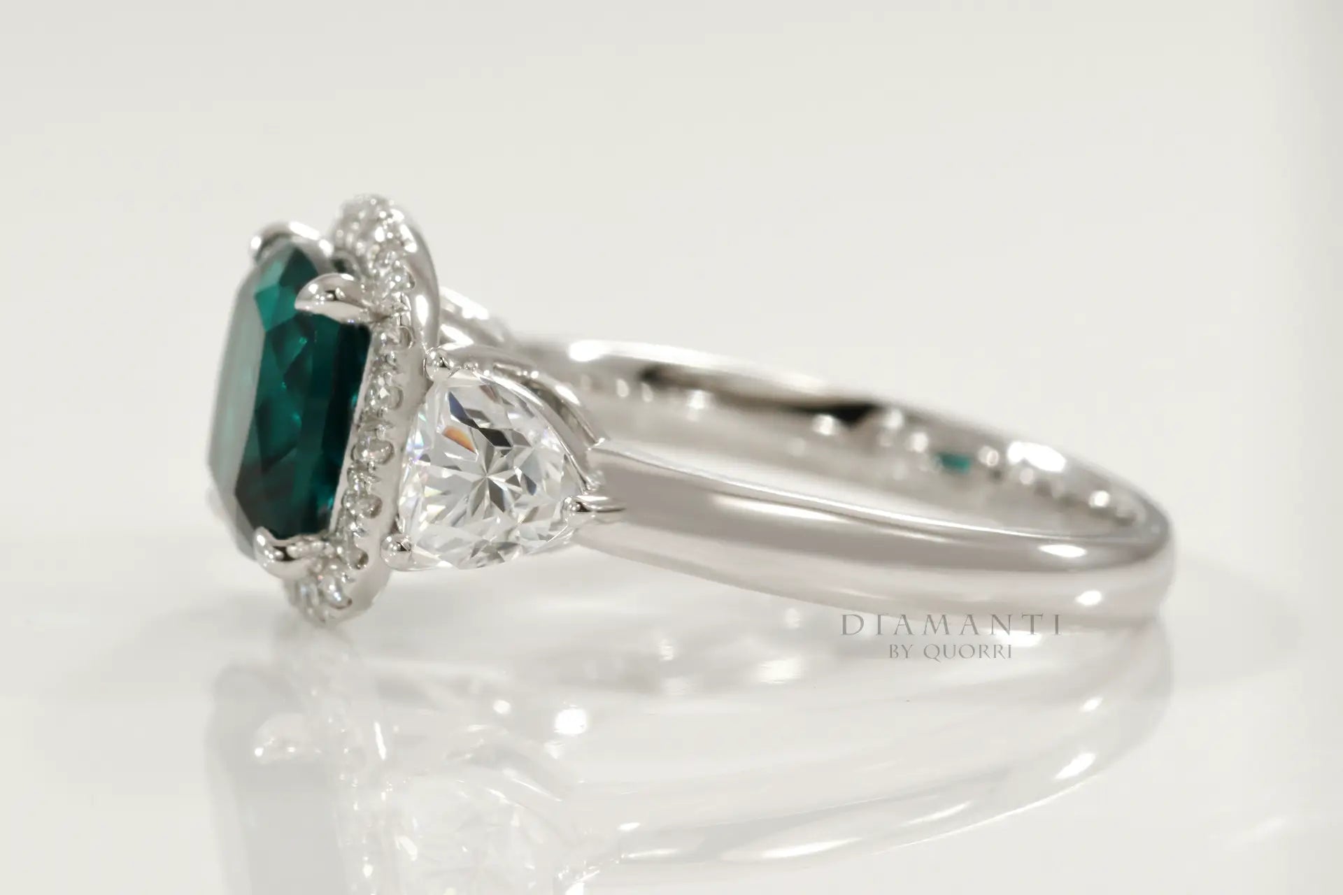 platinum designer three stone cushion green emerald and trillion halo diamond engagement ring Canada
