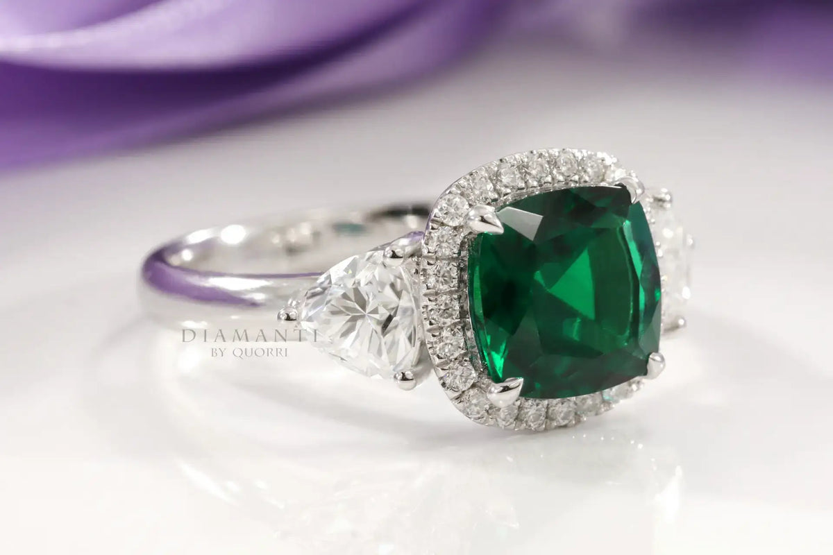 designer three stone green emerald and trillion halo diamond engagement ring Canada