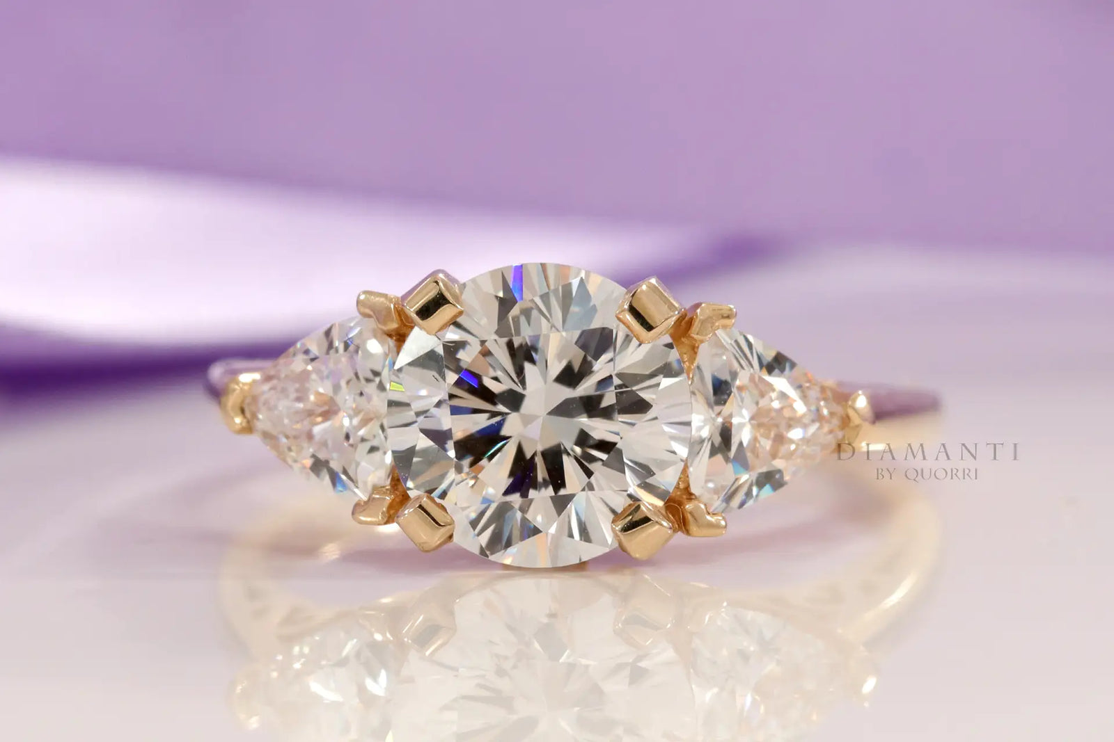 18k yellow gold three stone trilogy round and trillion lab created diamond engagement ring