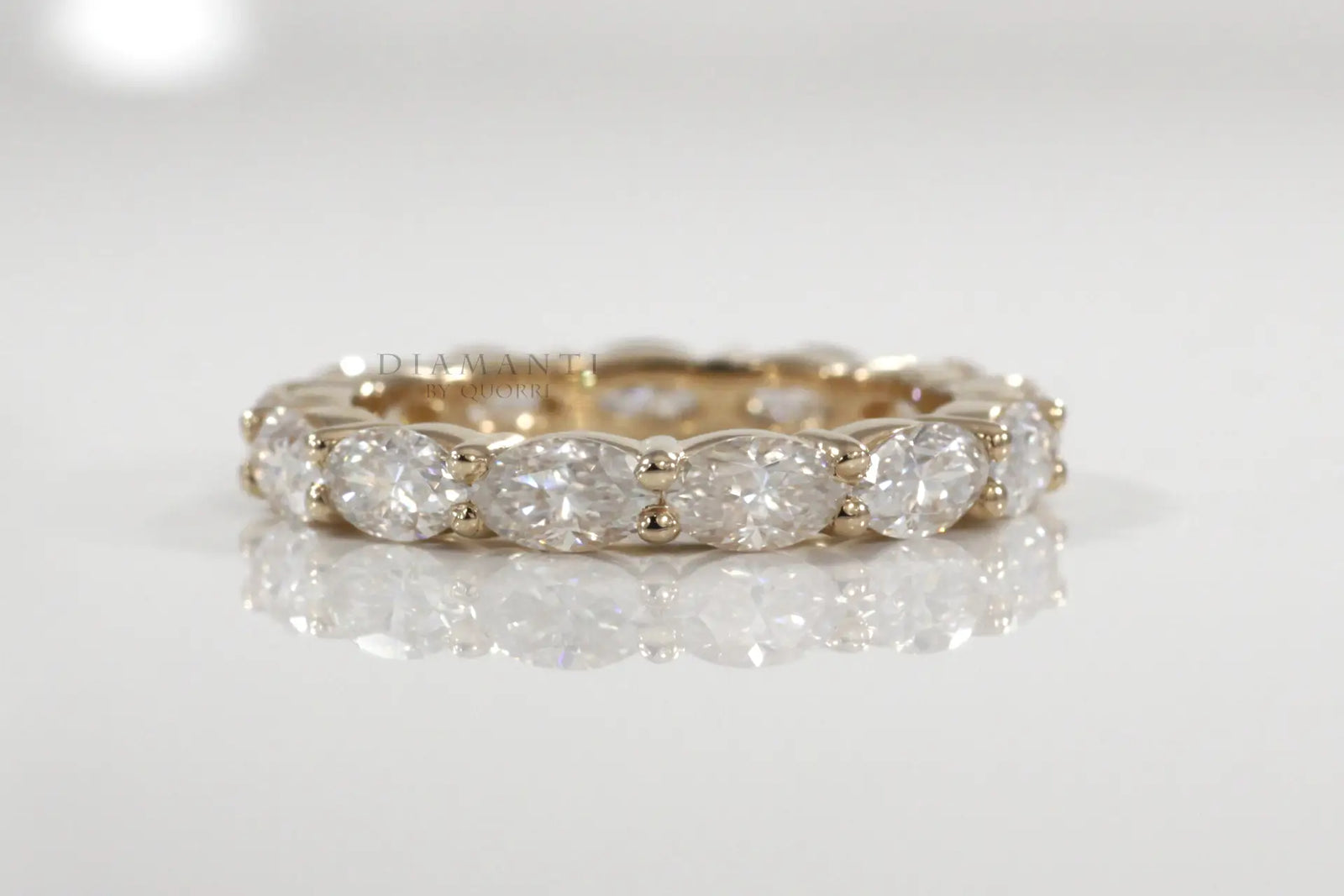 designer 18k yellow gold 4 carat east west oval lab diamond eternity anniversary and wedding rings Quorri Canada