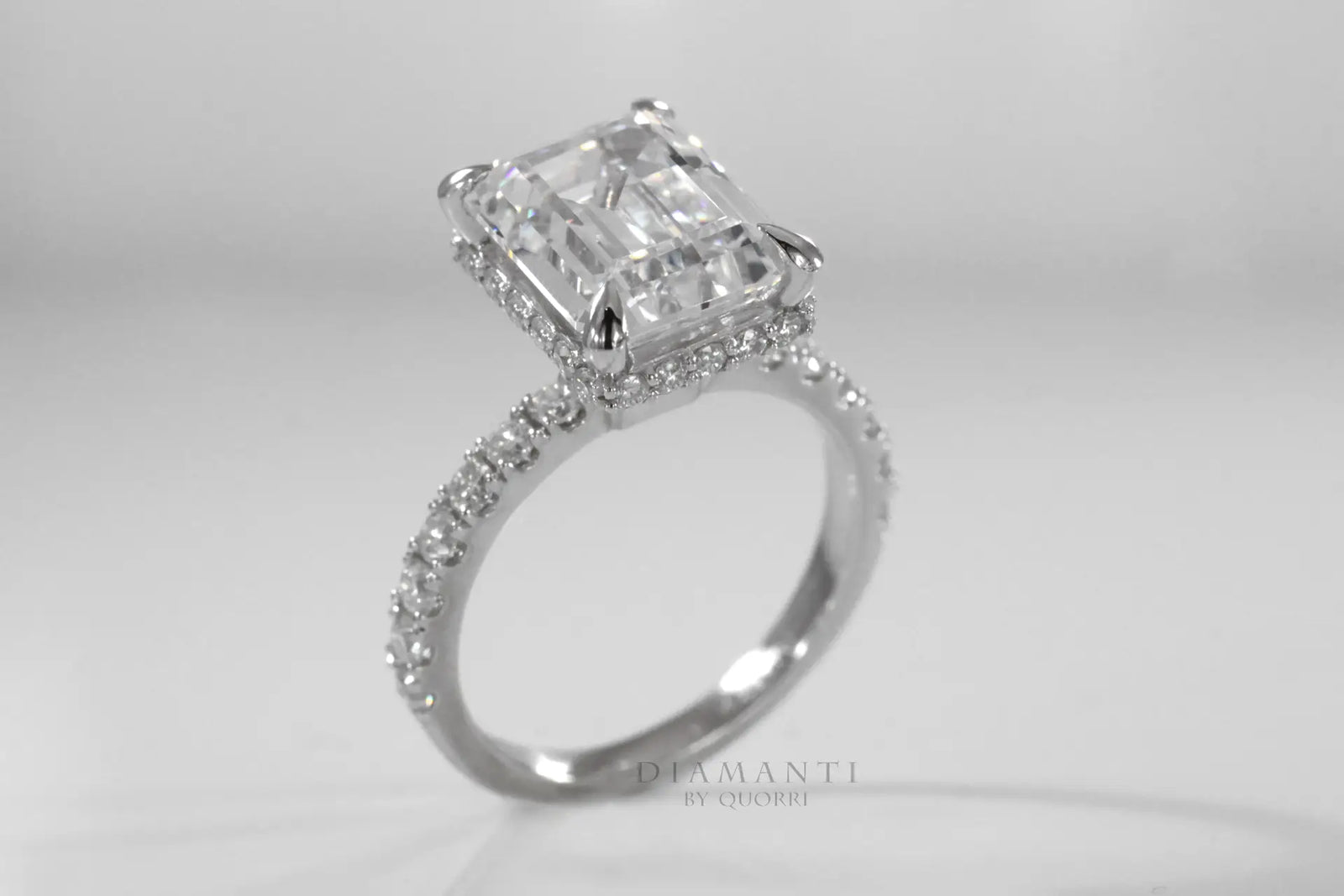 accented under halo claw prong emerald lab diamond engagement ring