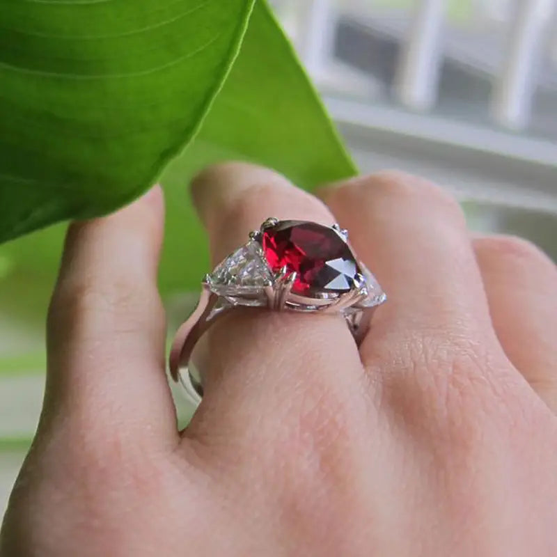 three stone dual claw prong cushion cut blood red cultured lab grown ruby ring
