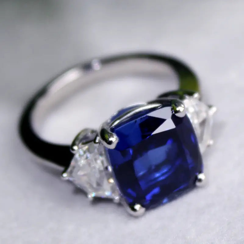 white gold three stone ring with cultured lab grown blue sapphire and half moon