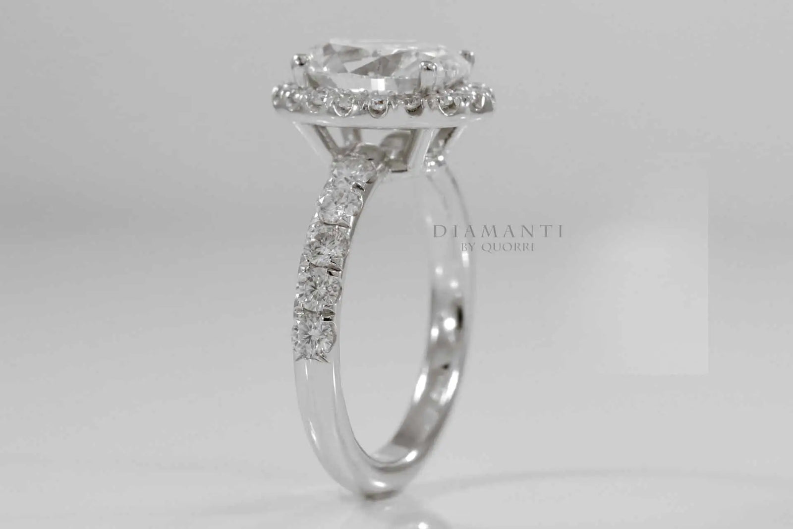 2 carat oval lab created diamond halo engagement ring in solid 18k white gold at Quorri Canada