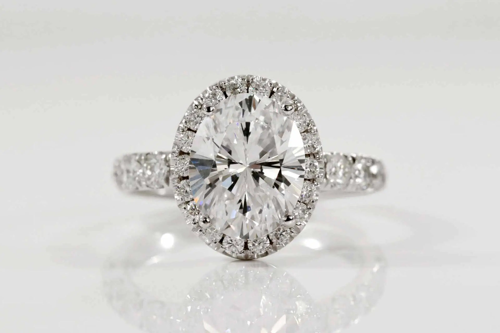 5 carat oval lab diamond halo accented engagement ring in solid 18k white gold at Quorri Canada