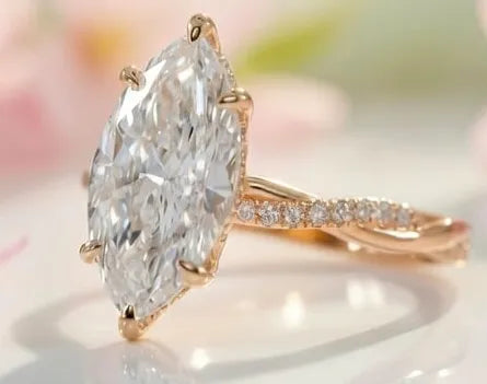 Rose gold ring with a large marquise-shaped diamond for spring sale at Quorri