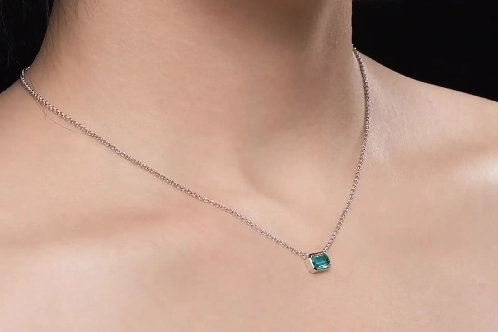 Canadian designer 14k white gold bezel set 1.50 carat lab grown green emerald pendant with built in chain at Quorri