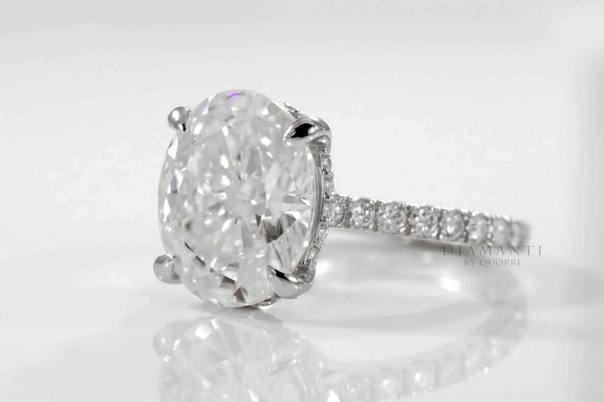 designer hidden halo claw prong 18k white gold 3 carat oval lab diamond engagement ring Quorri Canada