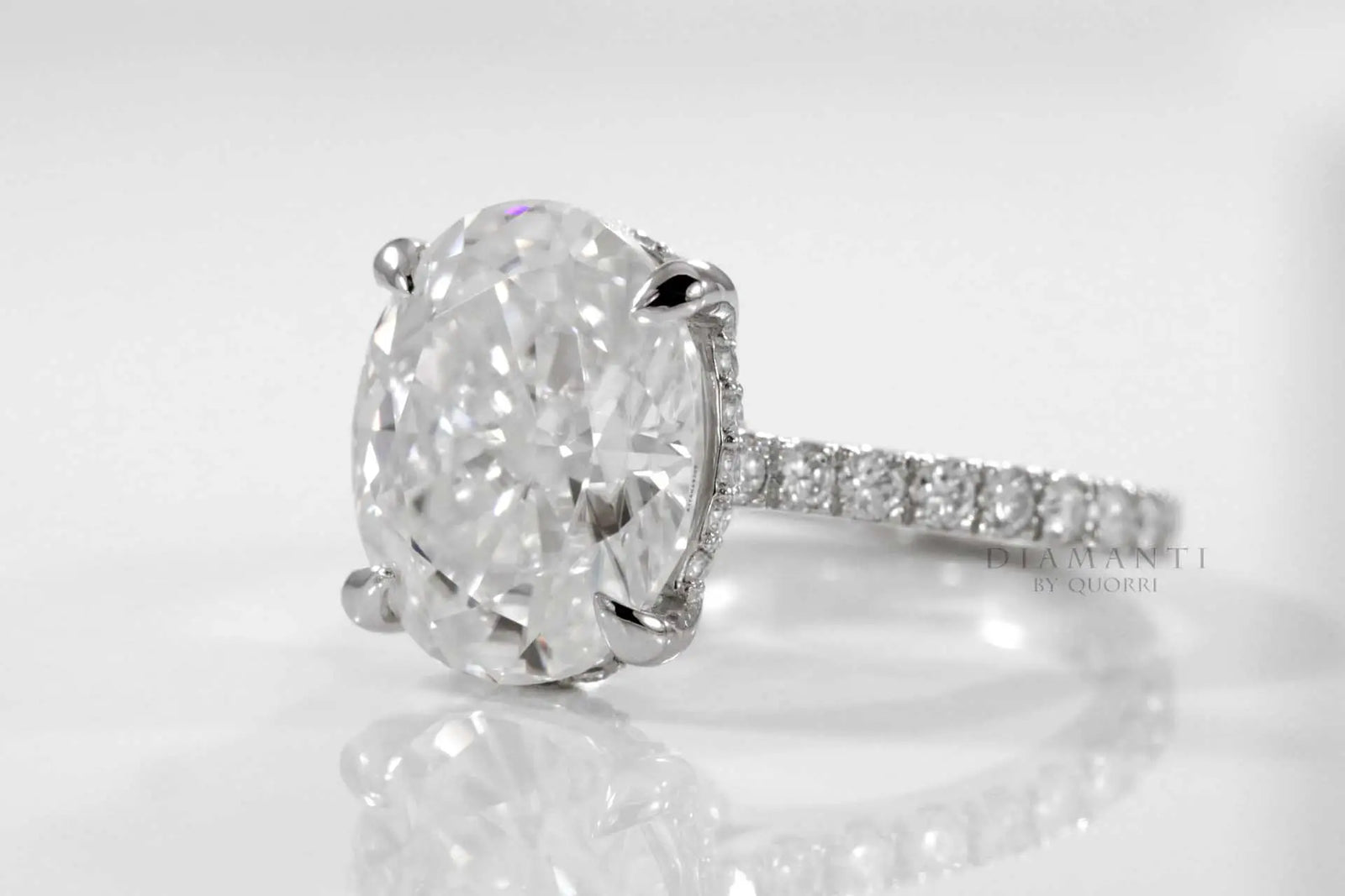 designer hidden halo claw prong 18k white gold 3 carat oval lab diamond engagement ring Quorri Canada