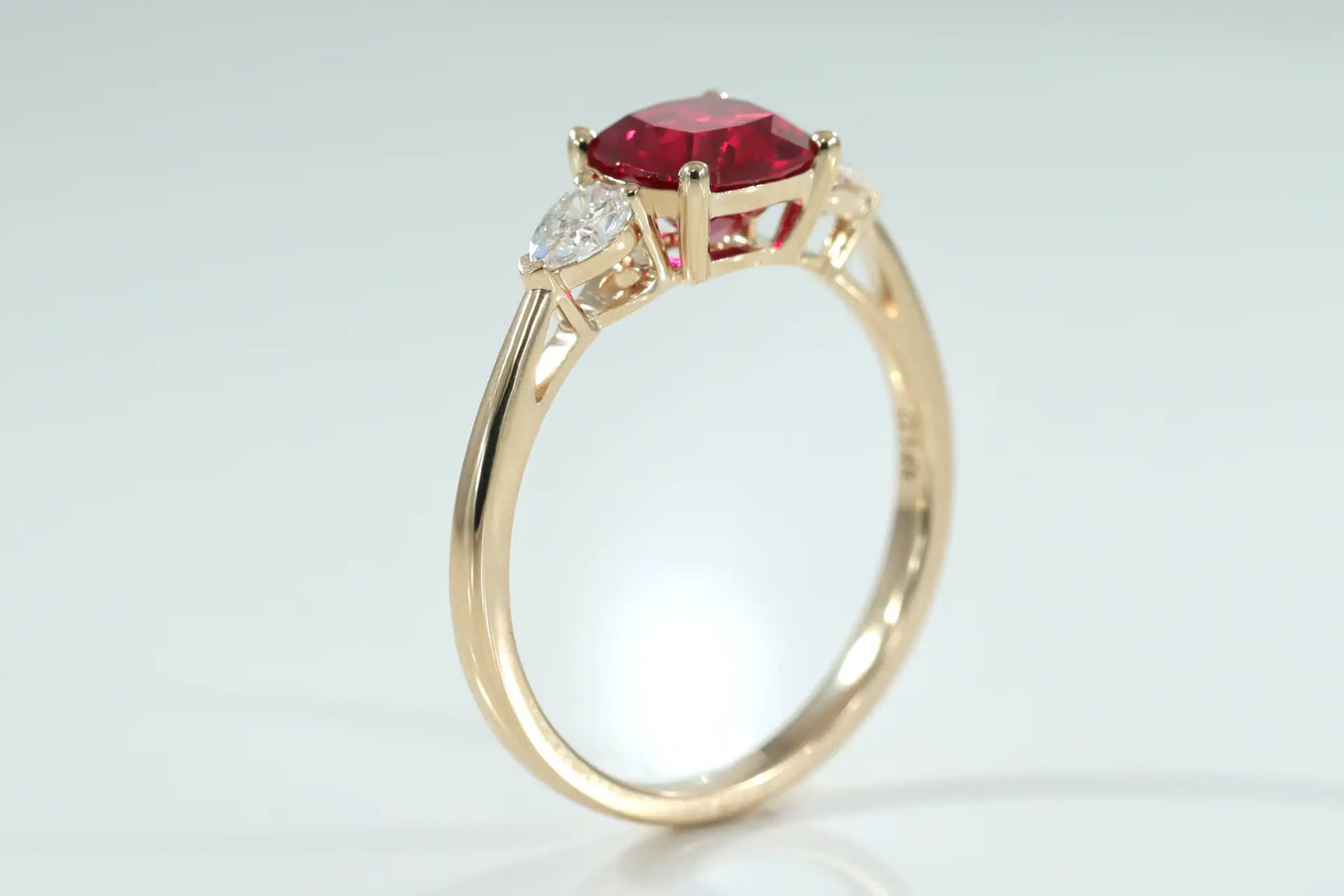 designer 14k yellow gold 3-stone 1.50 carat lab grown cushion ruby and pear lab diamond engagement ring Quorri
