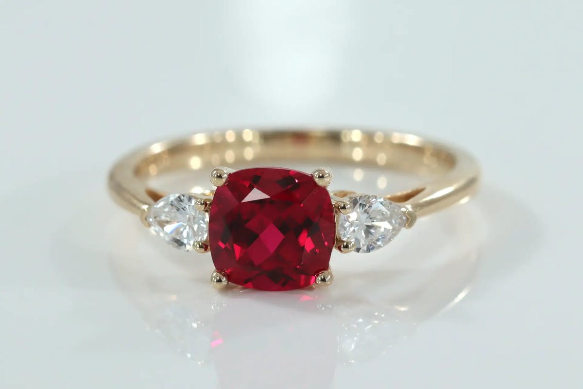 designer 14k yellow gold three stone 2 carat lab grown blood red cushion and pear lab diamond engagement ring Quorri Canada