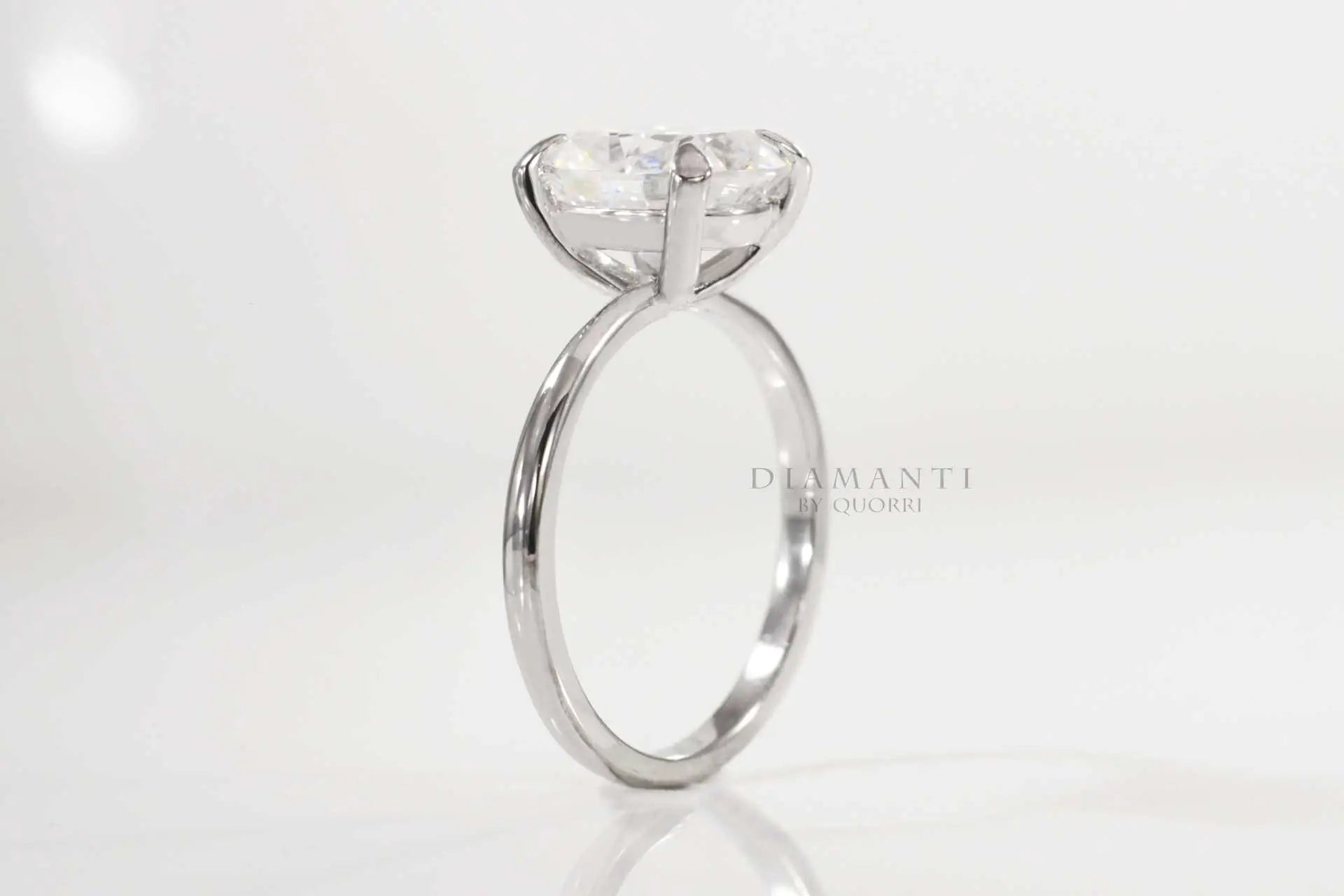 claw prong white gold elongated cushion lab diamond engagement ring Quorri