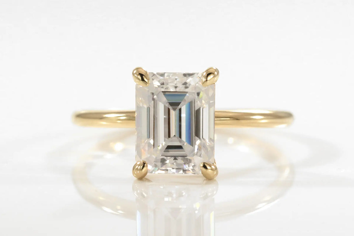 affordable 18k yellow gold claw prong 2 carat emerald cut lab diamond solitaire engagement ring Quorri