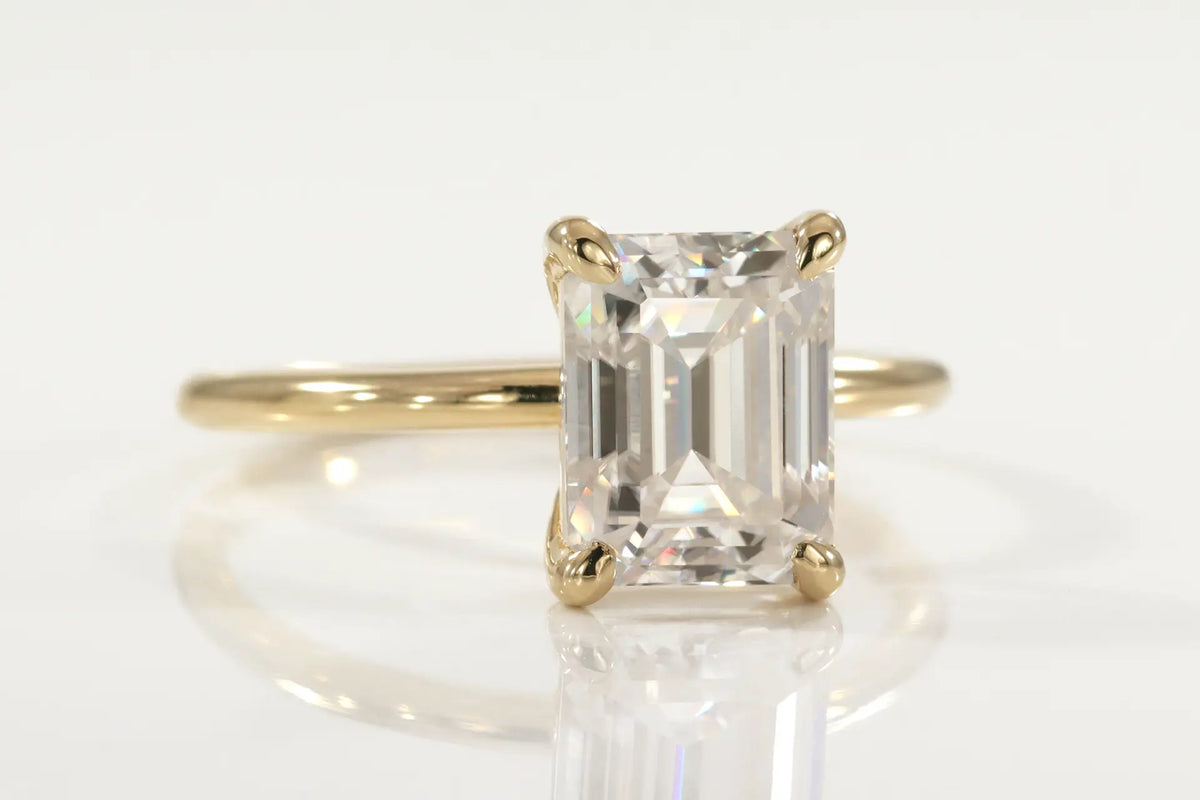 affordable designer 18k yellow gold claw prong 2 carat emerald cut lab grown diamond solitaire engagement ring Quorri Canada