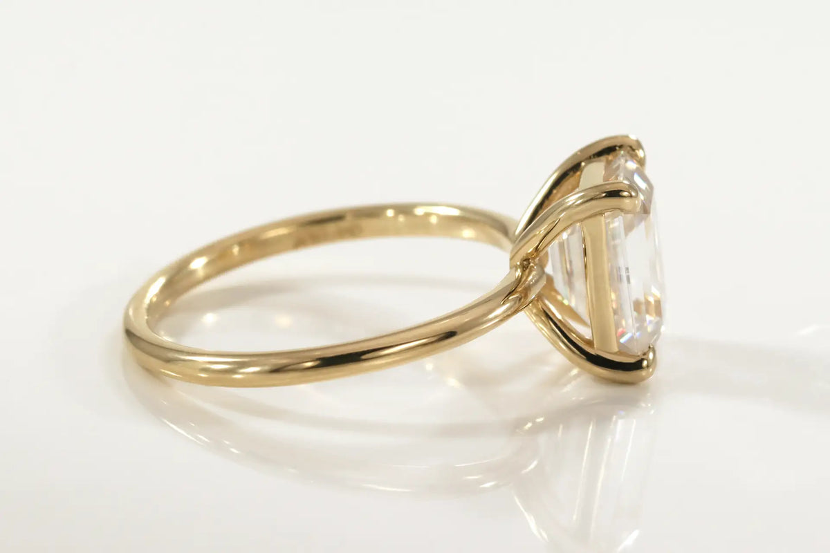 designer affordable 14k yellow gold claw prong 1.50 carat emerald cut lab created diamond solitaire engagement ring Quorri