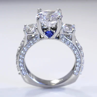 Vera wang inspired three-stone accented diamond engagement ring