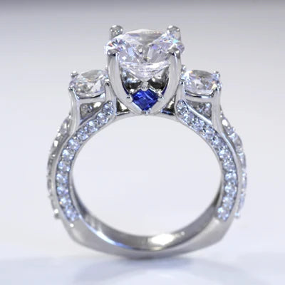 Virtuous Dram designer three-stone round lab diamond engagement ring with sapphire accent - Quorri
