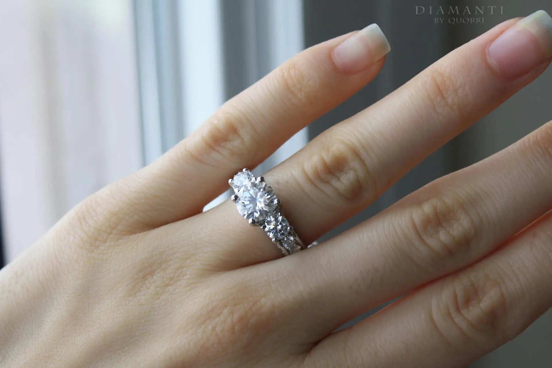 low cost vera wang inspired accented 3 stone round lab diamond engagement ring Quorri Canada