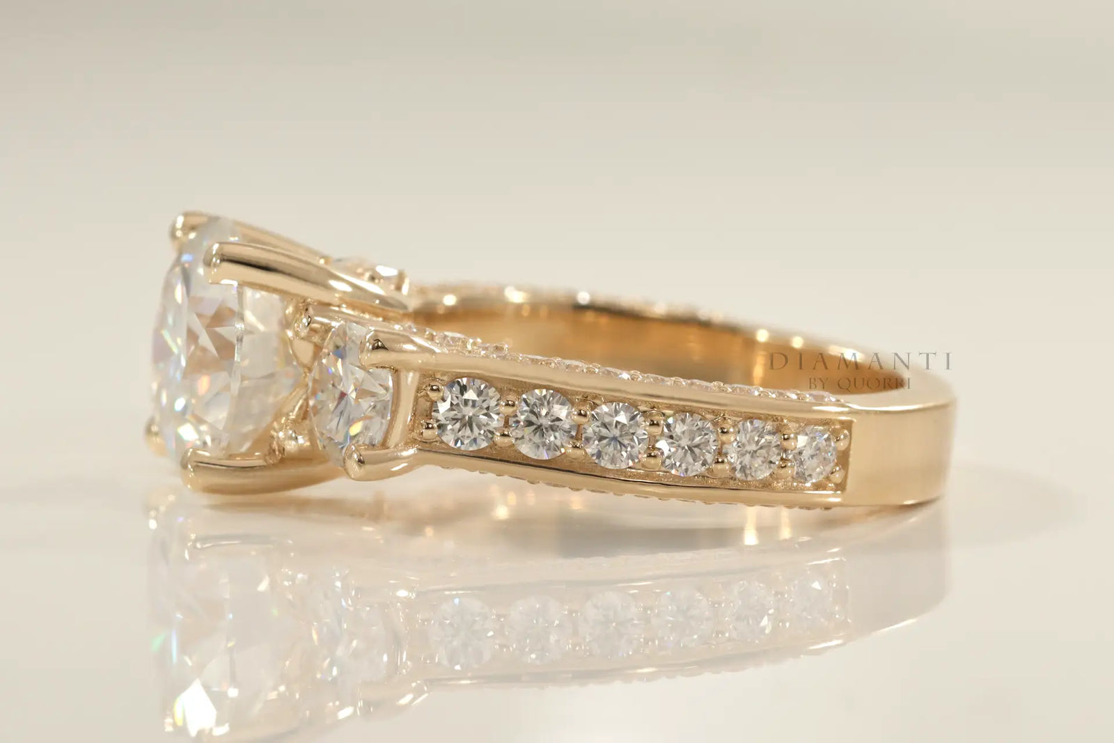 accented 18k yellow gold designer three stone 2 carat round lab diamond engagement ring Quorri