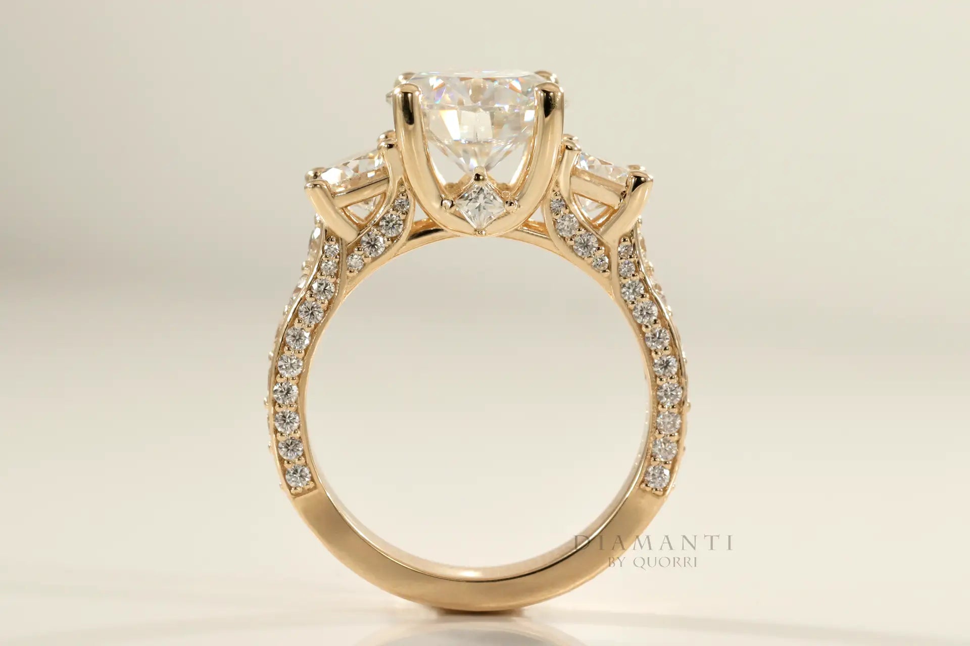 yellow gold designer three stone round lab diamond engagement ring Quorri