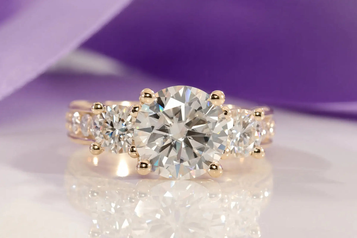 yellow gold designer elaborate three stone round lab diamond engagement ring Quorri