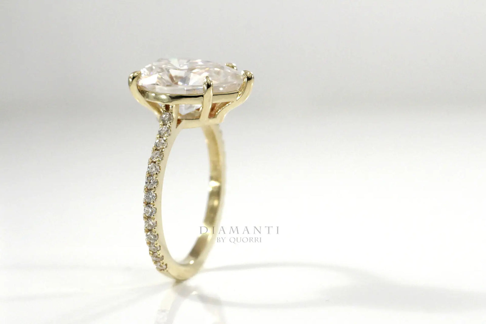 designer 5 prong 18k yellow gold 3.5 carat lab diamond pear accented engagement ring Quorri