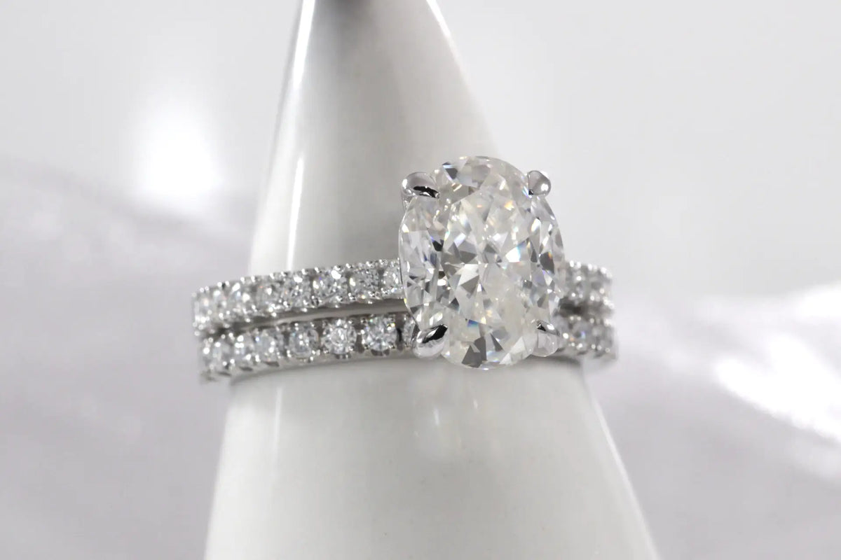 designer accented scalloped 1k white gold 2 carat Oval lab grown diamond solitaire ring and round brilliant wedding band at Quorri Canada